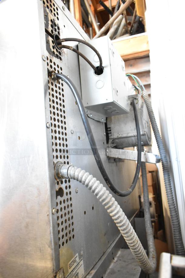 Back view of Southbend SilverStar convection oven showing wiring and metal components, indicating industrial use.