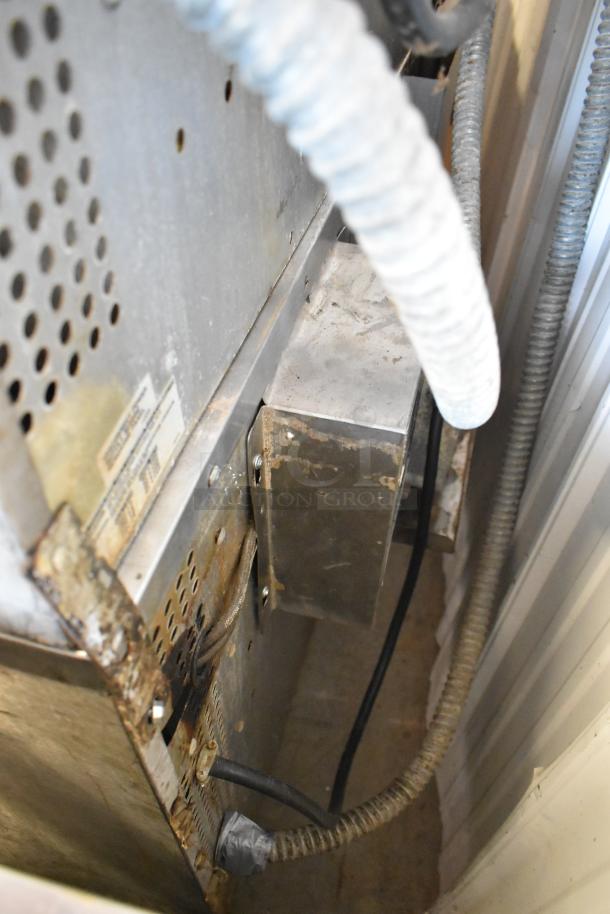Rear view of Southbend SilverStar stainless steel commercial convection oven, showing metal casing and electrical wiring.
