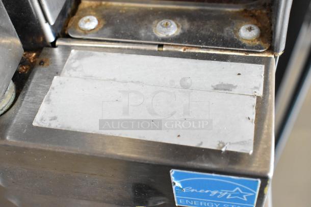 Southbend SilverStar stainless steel convection oven corner with visible labels and screws, showcasing wear and rust.