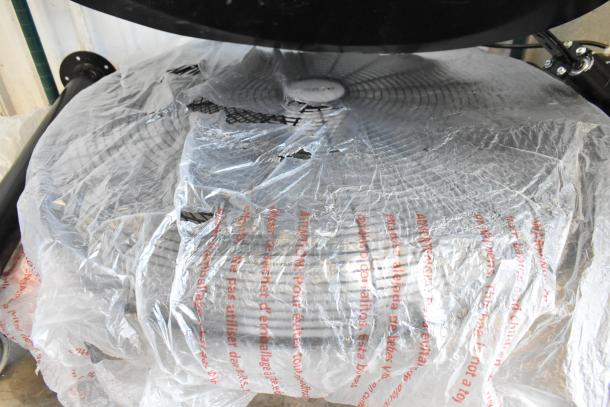 Brand new Boltic VF-30PBCO 30" 3-speed pedestal fan, partially wrapped, showing blades. Scratch and dent condition.