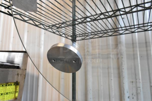 Round glass pane with metal mounting bracket, pristine condition. Ideal for use in doors or windows.