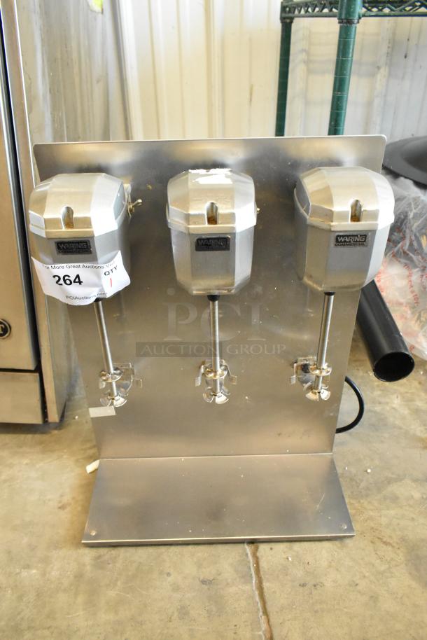 Waring DMC201DCA 3 Head Drink Mixer, stainless steel, 120 volts, 1 phase, with visible model and auction label.