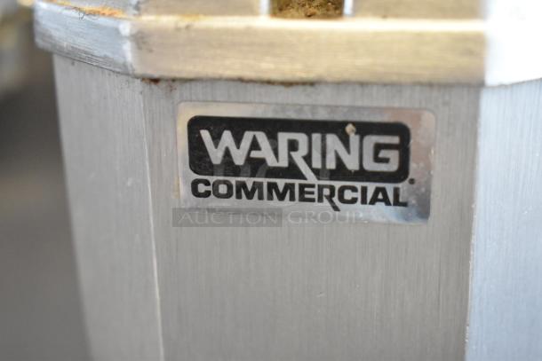 Waring DMC201DCA Stainless Steel Countertop 3 Head Drink Mixer. Visible Waring Commercial logo. 120V, 1 Phase.