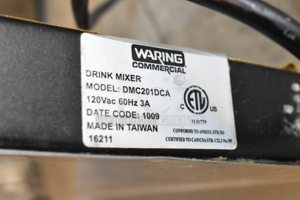 Waring DMC201DCA stainless steel drink mixer label, 120V, 60Hz, 3A. Date code 1009, made in Taiwan.