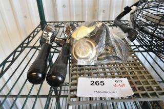 Lot of espresso machine items, including portafilters and baskets, in new to used condition, with auction tag #265.