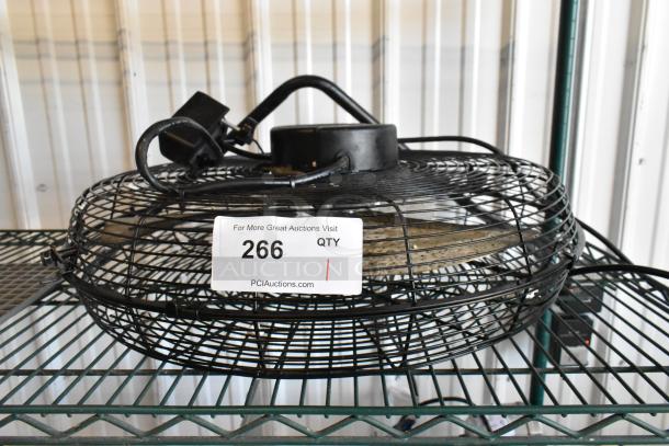 Lasko H20060 metal fan, 120 volts, 1 phase. Black metal frame, seen on a wire shelf, auction lot number 266 visible.