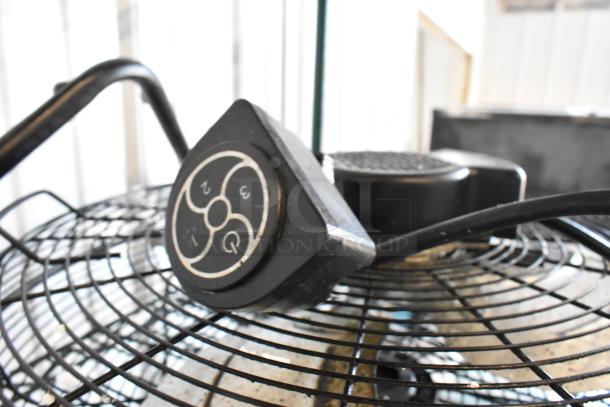 Lasko H20060 metal fan with 120 volts, 1 phase, control dial visible, metal grill in good condition.