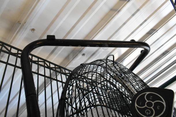 Lasko H20060 Metal Fan, 120 Volts, 1 Phase. Black frame, three-speed control, visible metal guard, used condition.
