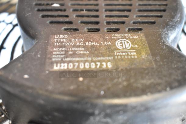 Lasko H20060 metal fan label, 120V AC, 1 phase, 1.0A, ETL certified. Made in China. Model, patent, and serial number visible.