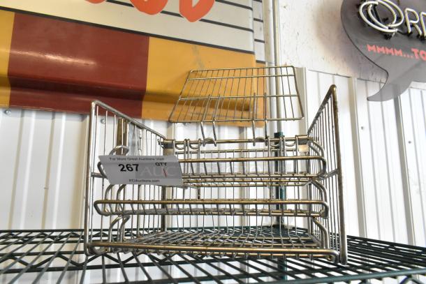 Metal pressure fryer rack with grid design, in good condition. Auction tag reads "267" by PCI Auctions.