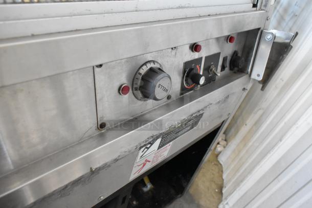 Federal Industries SN4HD refrigerated display case controls, visible dials and switches, metal exterior, commercial use.