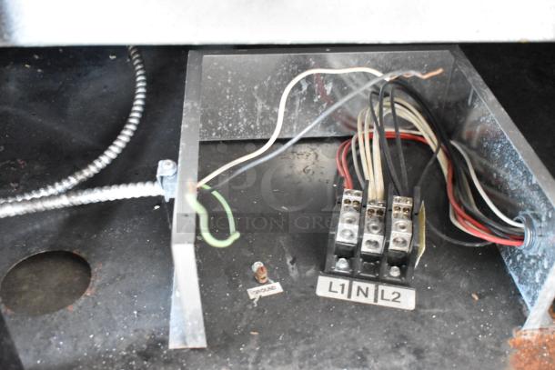 Electrical components inside Federal Industries SN4HD refrigerated display case, showing labeled connections L1, N, L2, and ground wire.