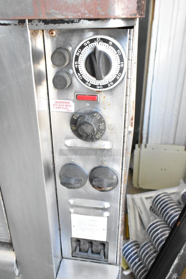 Blodgett 1201-R stainless steel pizza oven controls, timer, and temperature knobs. Moderate wear, warning label visible.