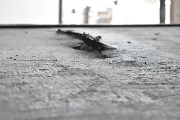 A damaged cooking stone surface for Blodgett 1201-R pizza oven, showing visible wear and tear.