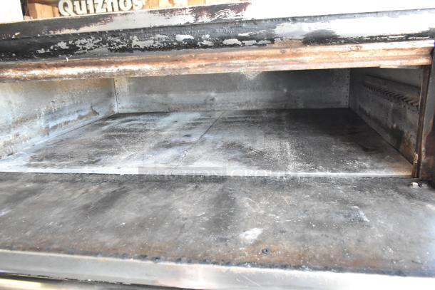 Blodgett 1201-R stainless steel commercial pizza oven, single deck, with cooking stones, on metal legs. Electric, 230-240V, 1 phase.