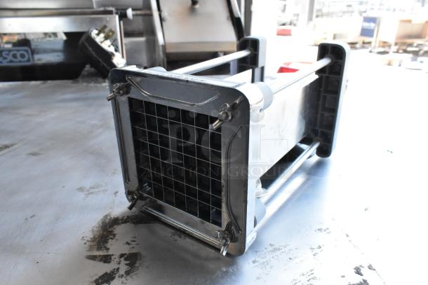Metal countertop vegetable cutter with a grid blade, stainless steel construction, in good condition.