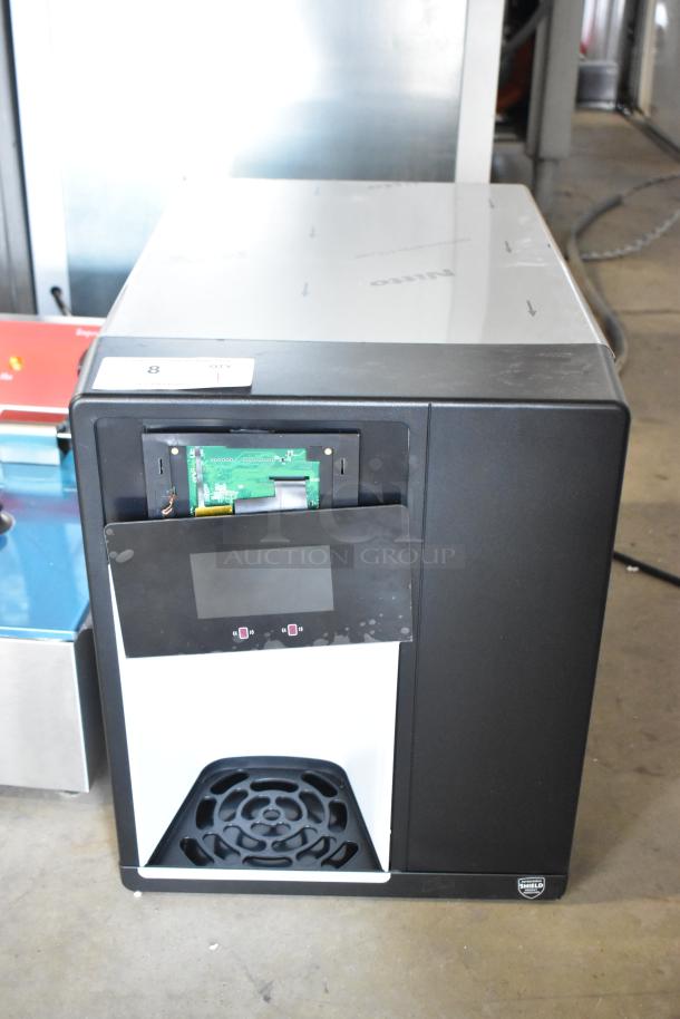 Follett Champion 7 Series ice maker and water dispenser, model 7CI112A-IW-NF-ST-00, in used condition with exposed internal components.