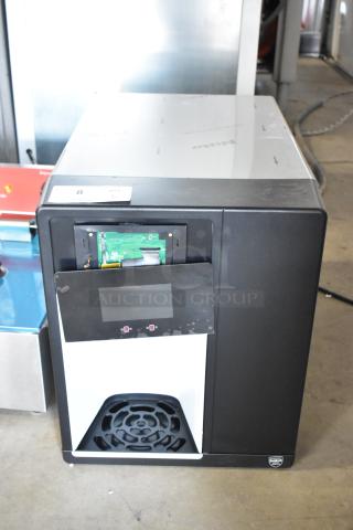 Follett Champion 7 Series ice maker and water dispenser, model 7CI112A-IW-NF-ST-00, in used condition with exposed internal components.