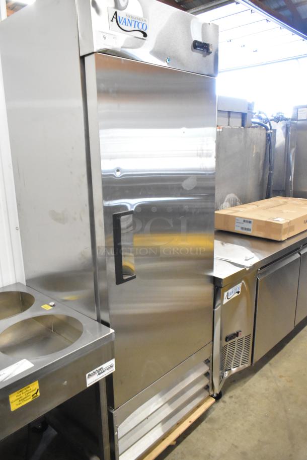 Brand new Avantco 178A19RHC stainless steel reach-in cooler, single door, poly-coated racks, on commercial casters.