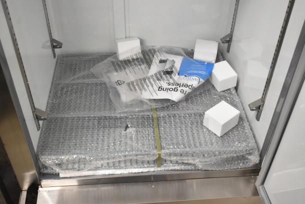 New Avantco 178A19RHC stainless steel cooler, poly-coated racks, commercial casters. Includes packaging materials inside.