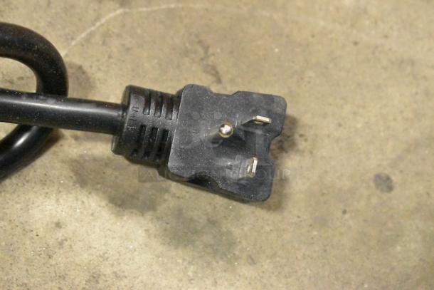 Close-up of a power cord plug for the Avantco 184T140 stainless steel conveyor toaster.
