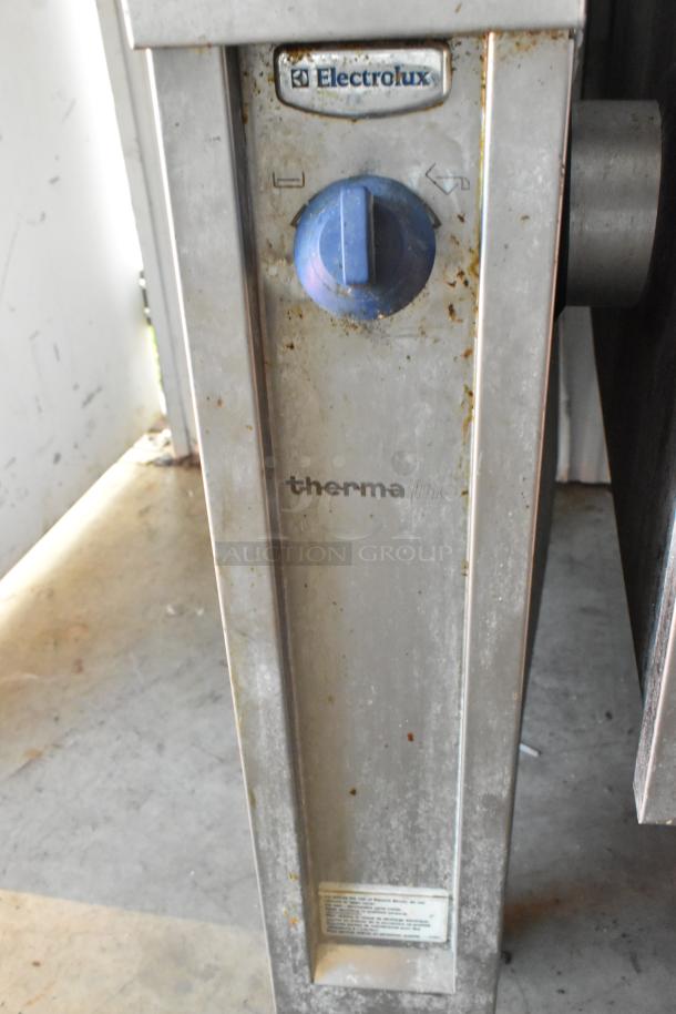 Electrolux stainless steel commercial braising pan, floor style, 208V, 3 phase, visible wear, with control knob and branding.