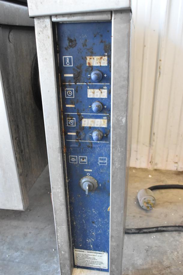 Electrolux stainless steel commercial braising pan, 208V, 3 phase, floor style. Features control panel with temperature, timer, and settings. Slight wear visible.