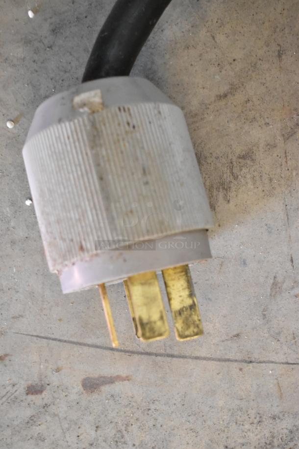 Electrolux commercial power plug for stainless steel braising pan, 208 volts, 3 phase; shows plug details and condition.