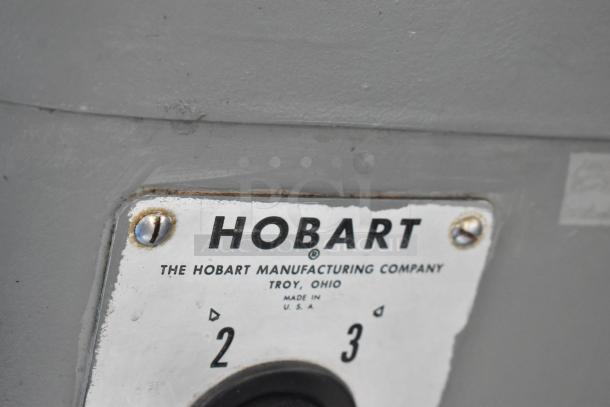 Hobart H-600 commercial mixer label, showing model and manufacturing details. Durable metal construction.