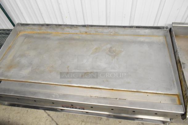 Vulcan stainless steel commercial griddle, used condition, flat top design, suitable for countertop, visible wear marks.