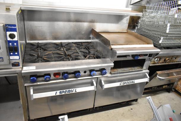 Imperial Stainless Steel 6-Burner Range with Right Side Flat Top Griddle, 2 Ovens, Overshelf, and Backsplash, on Casters.