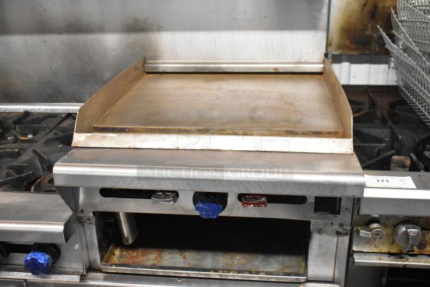 Imperial stainless steel 6-burner range with flat top griddle, 2 ovens, overshelf, back splash, and commercial casters.