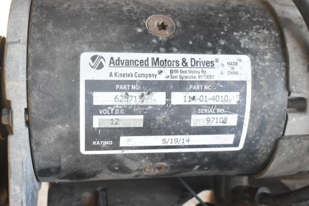 Advanced Motors & Drives label on EZ Go golf cart, part no. 111-01-4010, serial no. 97108, dated 5/19/14.