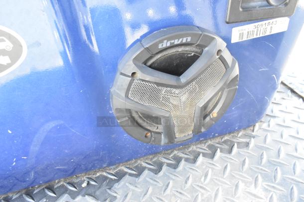 Close-up of a "drvn" speaker on a blue EZ Go golf cart, showing clear sound system integration with visible serial tag.