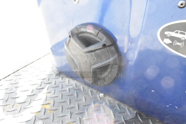 EZ Go blue golf cart detail showing an integrated speaker system on a metal footplate. Condition appears good.
