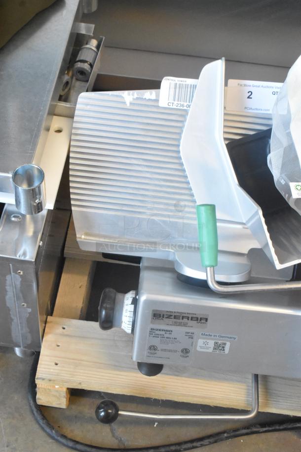 2023 Bizerba GSP HD meat slicer, metal body, integrated blade sharpener, 120V, 1 phase, excellent condition, visible labels.