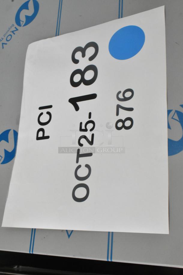 Stainless steel Hoshizaki KM-81BAJ ice machine with 38 lb bin visible, scratch and dent condition, auction tag attached.