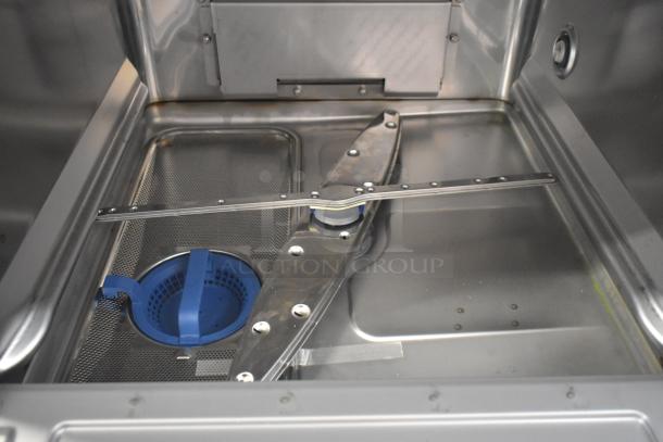 Hobart LXGNR stainless steel commercial glass washer interior, brand new condition, visible sprayer arm and filter.