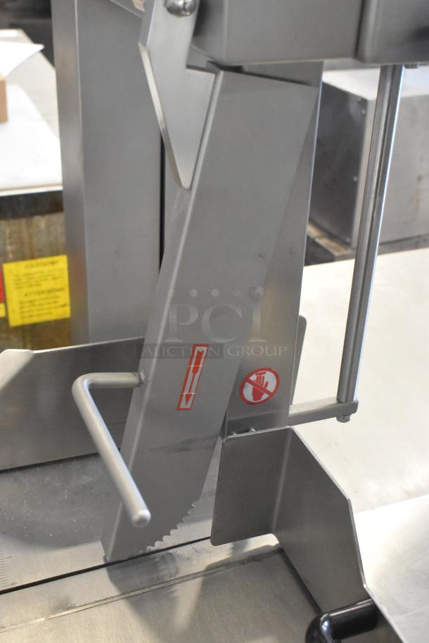 Brand new Avantco 177EMBS94SS stainless steel band meat saw, 94" blade, 3 hp, 220/240V, 3 phase, with safety markings.