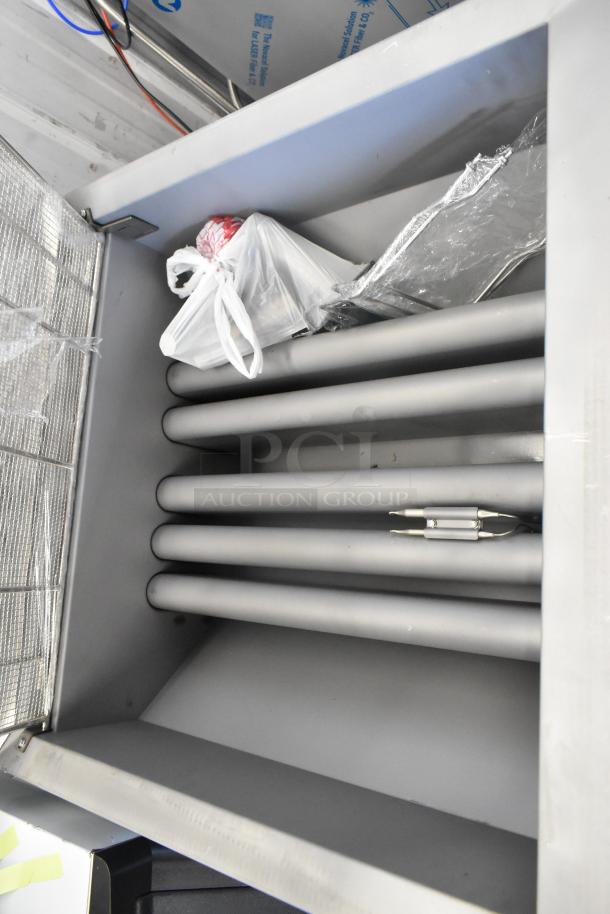 Avantco 177FBF2624NG stainless steel donut fryer, brand new with visible packaging. Natural gas, 120,000 BTU, 150-170 lb capacity.