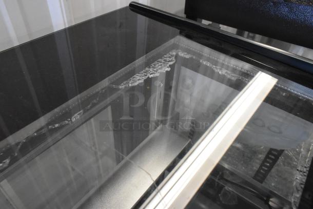 Brand new Avantco 193BCTD72B black bakery display case, 72", 3 shelves, LED lighting, broken glass visible, on casters.