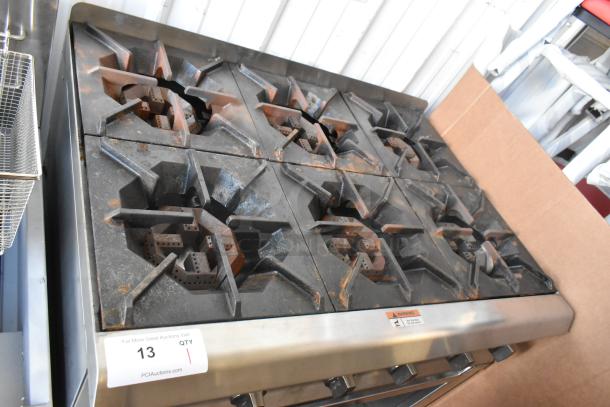 Commercial 6-burner gas countertop range; stainless steel; model 351RCPG36NL; 132,000 BTU; new scratch and dent condition.