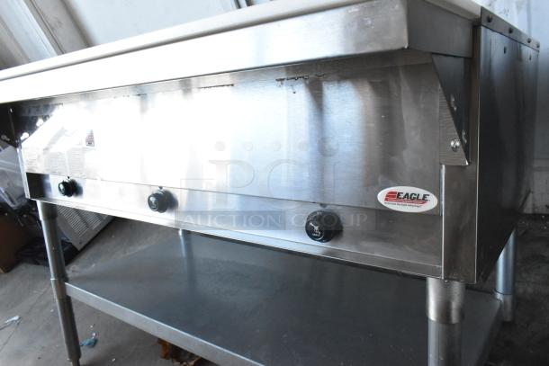 2022 Eagle HT3-LP 3 Bay Steam Table, stainless steel, propane gas, 10,500 BTU, with under shelf. Buttons and Eagle logo visible.