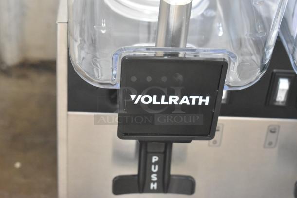 Brand new Vollrath VBBE2-37-S stainless steel commercial double 5.28 gallon refrigerated beverage dispenser with logo visible.