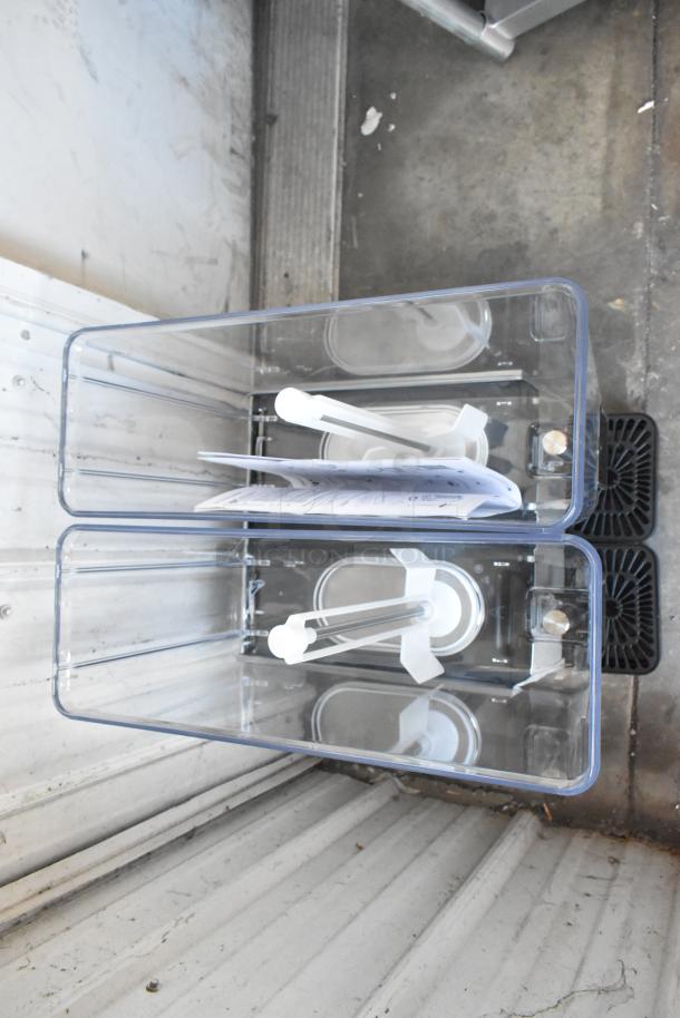 BRAND NEW SCRATCH AND DENT Vollrath VBBE2-37-S stainless steel double 5.28-gallon beverage dispenser with stirring paddle.