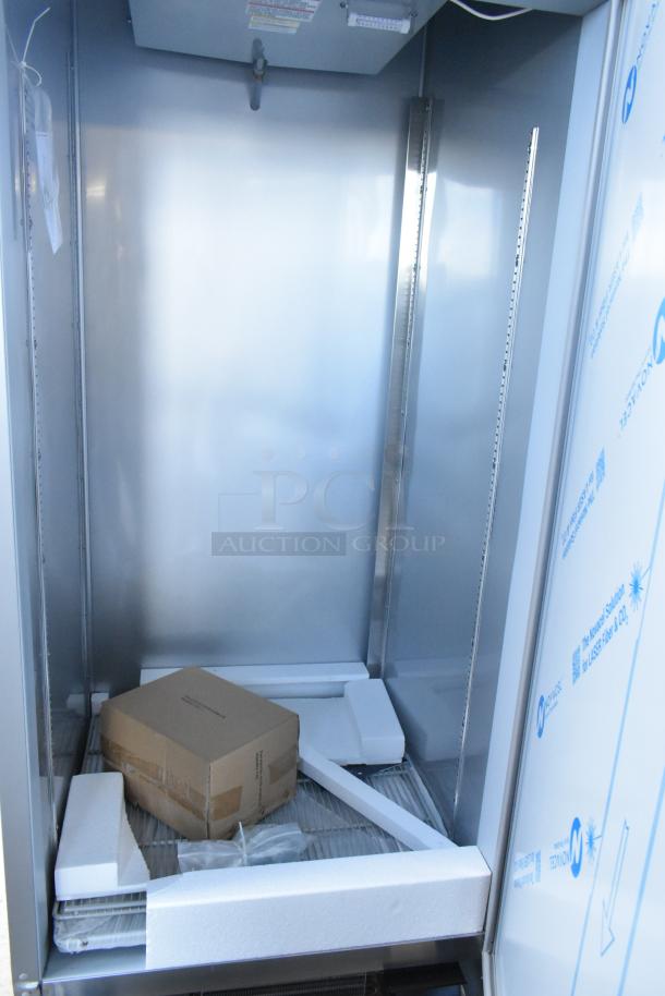 BRAND NEW Beverage Air FB27HC-1S stainless steel reach-in freezer, poly-coated racks, 115V, slight scratches, Interior view.