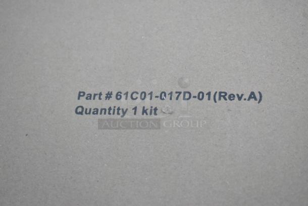 Cardboard surface displaying text "Part # 61C01-017D-01(Rev.A) Quantity 1 kit".