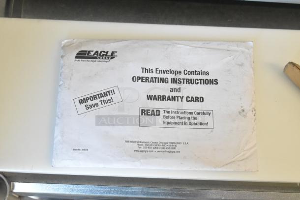 Operating instructions and warranty card envelope for Eagle DHT2-120 hot food table; important notices printed on it.