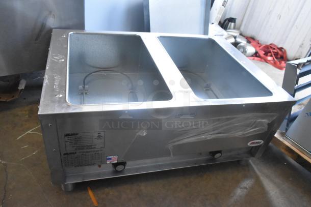 BRAND NEW Eagle DHT2-120 stainless steel electric hot food table, two-pan, 120V, 1 Phase, with some scratches.