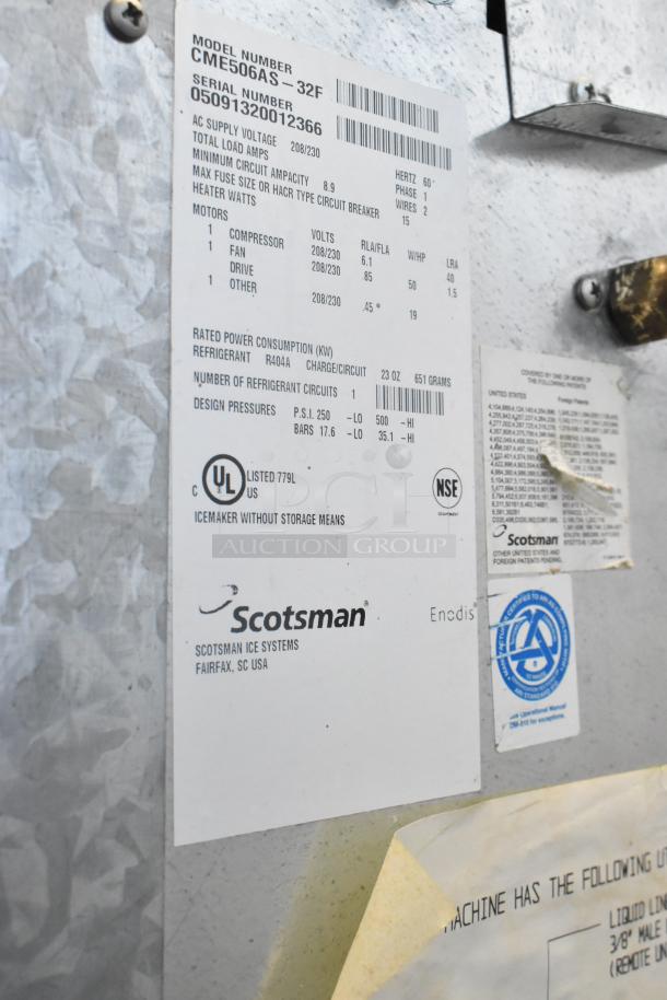 Scotsman CME506AS-32F stainless steel commercial ice head with labeled specifications, mounted on a Hoshizaki B570 ice bin, 208/230 volts.